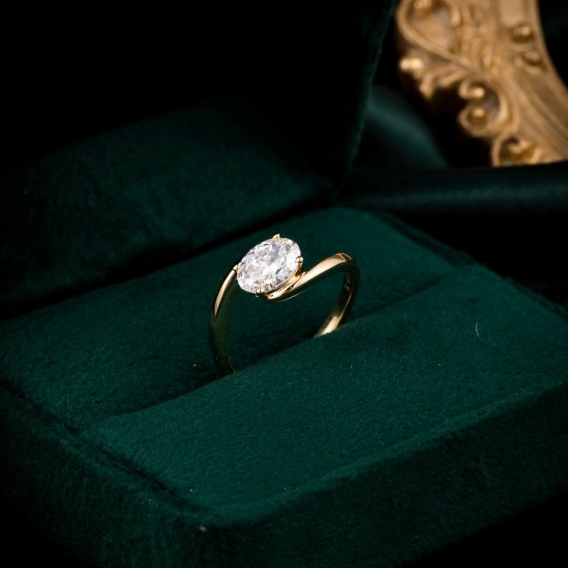 An oval solitaire lab-grown diamond ring in gold