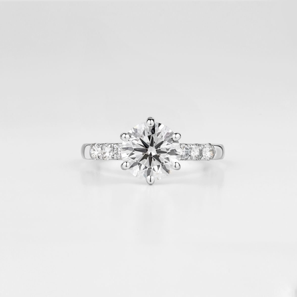Lab-grown diamond solitaire ring on a white background