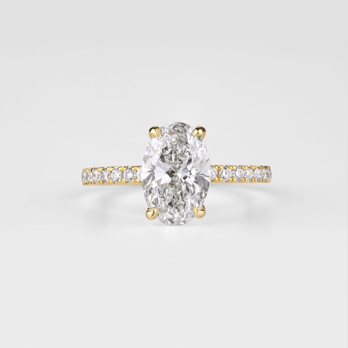 An oval lab-grown diamond solitaire ring in gold